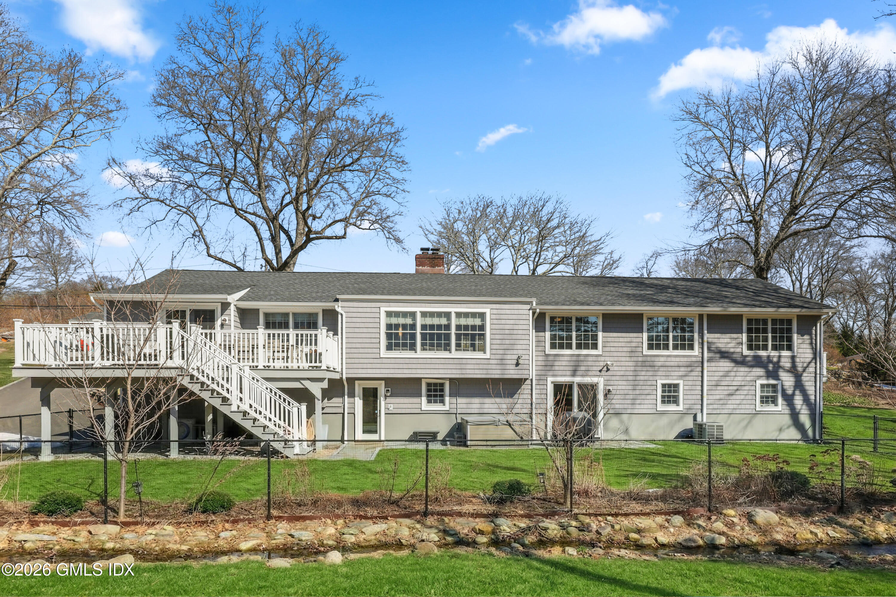 97 Davenport Ridge Lane Stamford, CT 06903 - Photo 30 of 31 a front view of a house with a garden