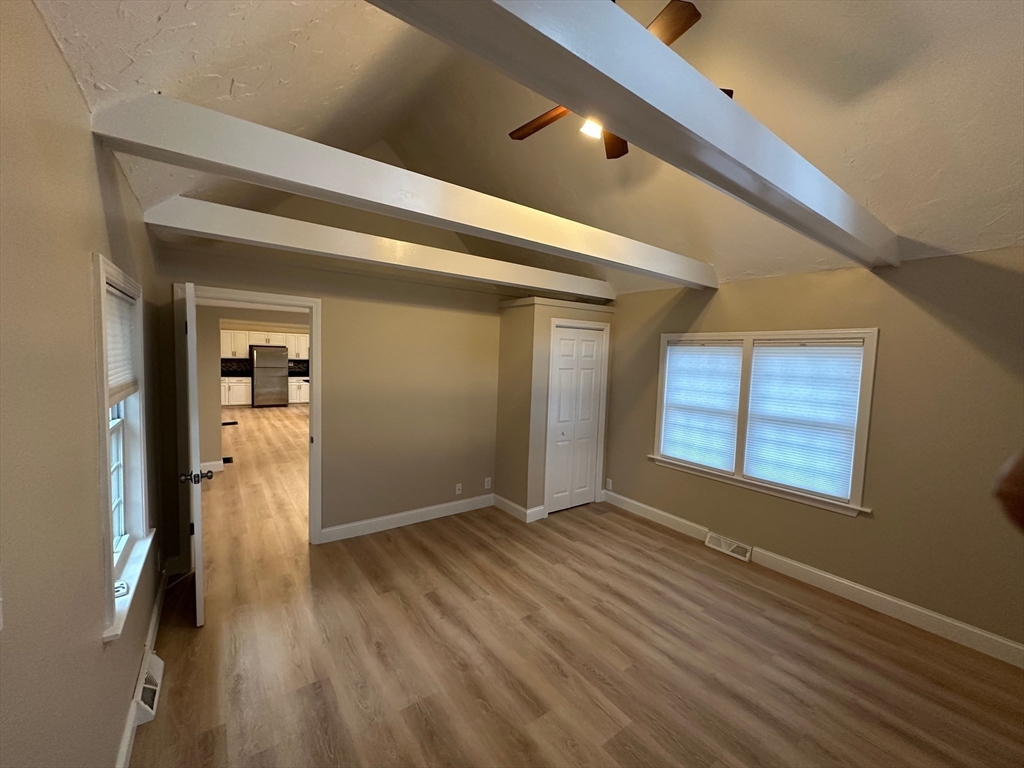 359 Mansfield Street, Unit 1 Sharon, MA 02067 - Photo 6 of 14 a view of a livingroom with wooden floor and a window