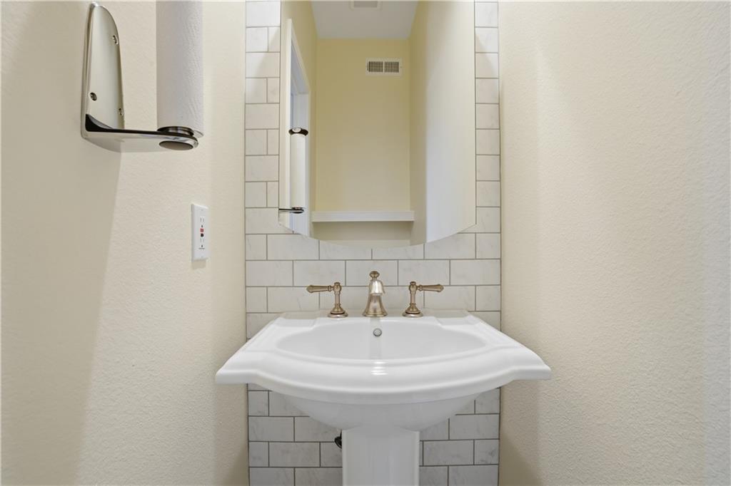 3777 Peachtree Road Northeast, Unit 932 Brookhaven, GA 30319 - Photo 13 of 26 a bathroom with a sink and mirror