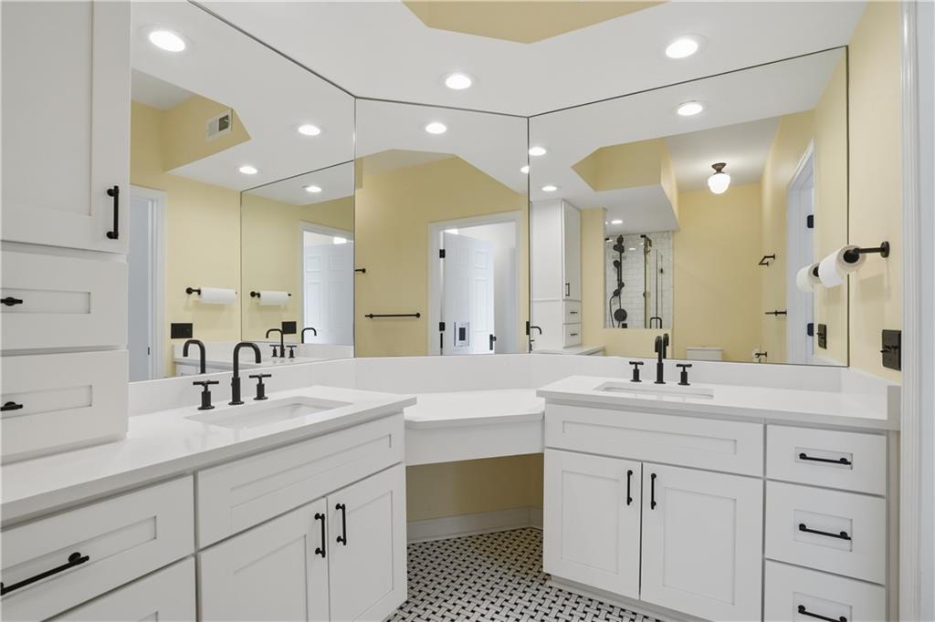3777 Peachtree Road Northeast, Unit 932 Brookhaven, GA 30319 - Photo 18 of 26 a bathroom with a double vanity sink mirror and double