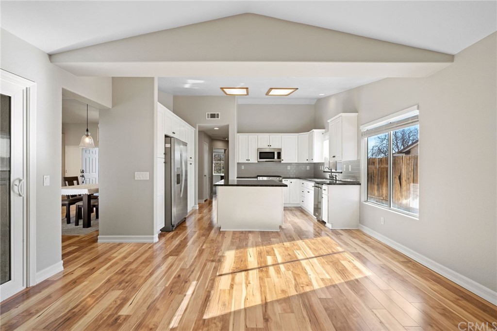 43345 Via Sabino Temecula, CA 92592 - Photo 11 of 22 a large kitchen with kitchen island a sink stainless steel appliances and cabinets