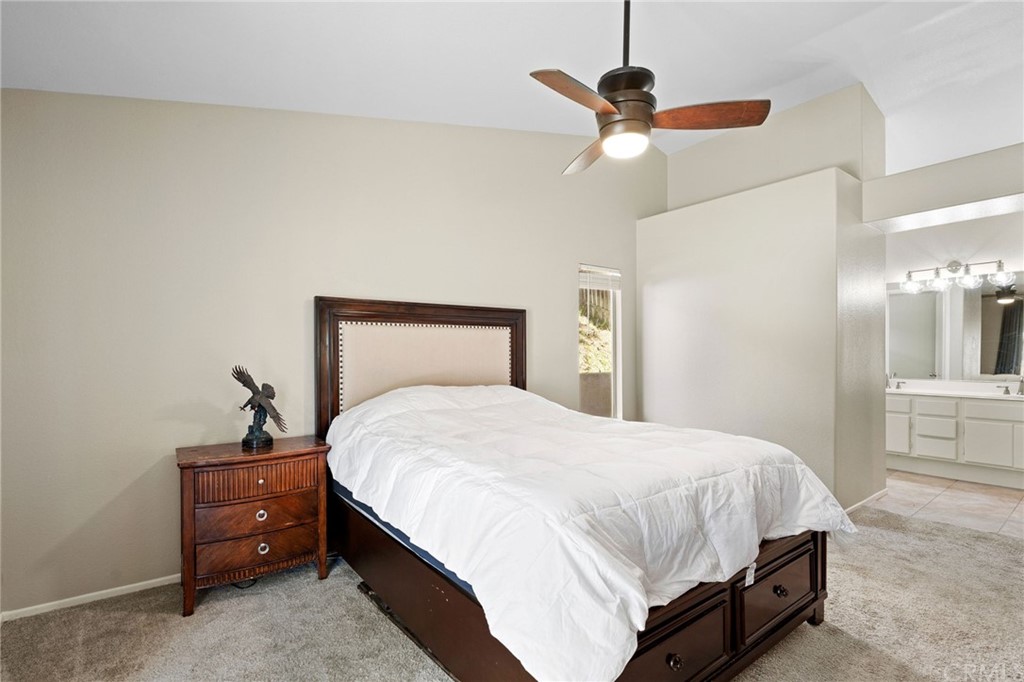 43345 Via Sabino Temecula, CA 92592 - Photo 15 of 22 a bedroom with a bed and ceiling fan