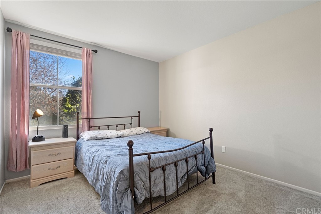43345 Via Sabino Temecula, CA 92592 - Photo 18 of 22 a bed sitting in a bedroom next to a window