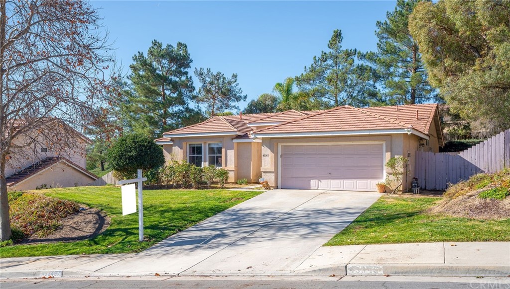 43345 Via Sabino Temecula, CA 92592 - Photo 2 of 22 a front view of a house with a garden and plants