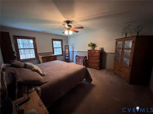 a bedroom with a bed and a couch