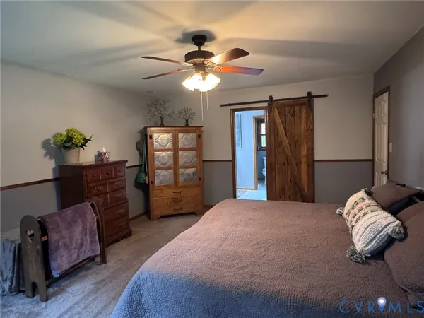 a spacious bathroom with a double vanity sink and a mirror