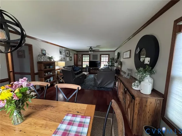 a open kitchen with refrigerator stove and wooden floor