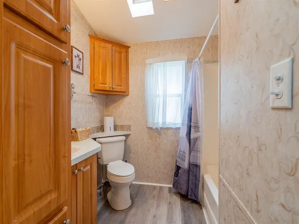 a bathroom with a toilet and a sink