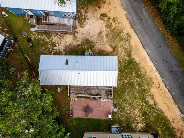 aerial view of a house with yard