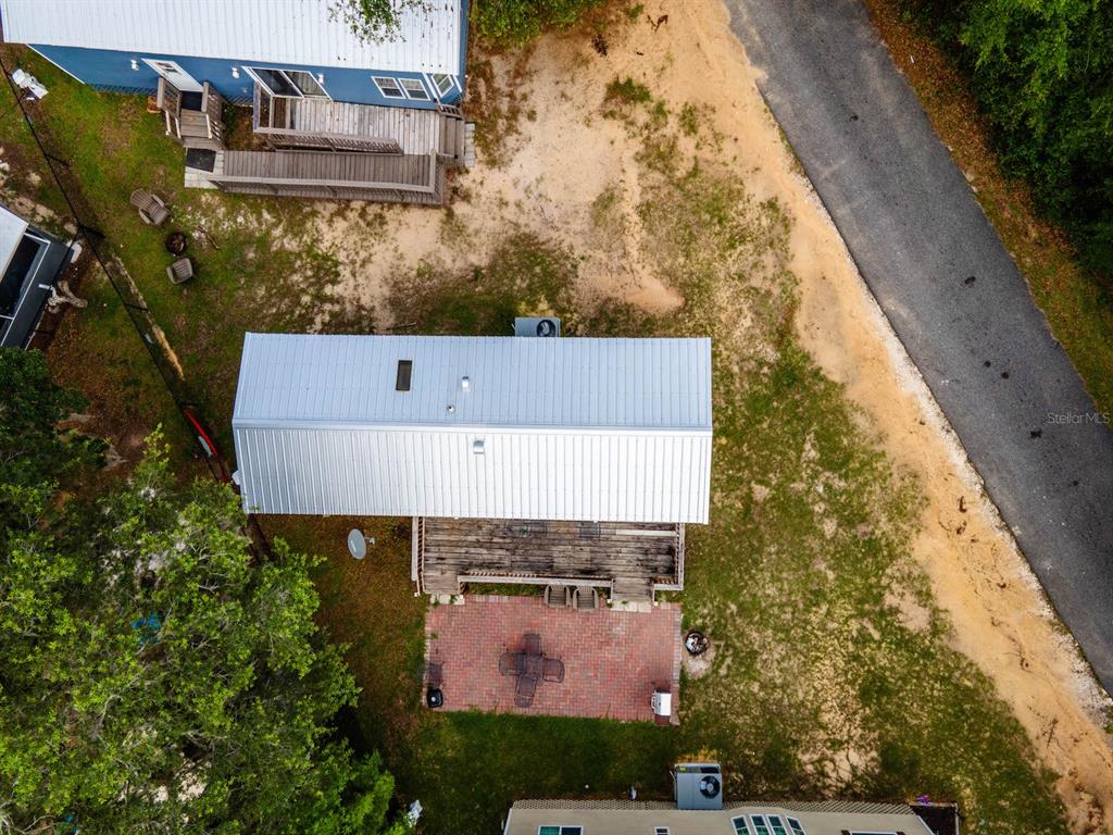 15991 Northeast 243rd Place Road, Unit 32 Fort McCoy, FL 32134 - Photo 19 of 27 aerial view of a house with yard
