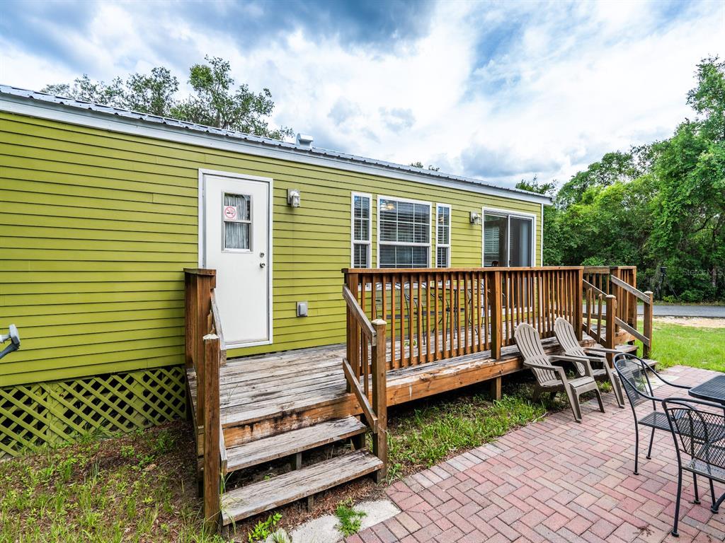 15991 Northeast 243rd Place Road, Unit 32 Fort McCoy, FL 32134 - Photo 6 of 27 a view of a chair setting on the roof deck