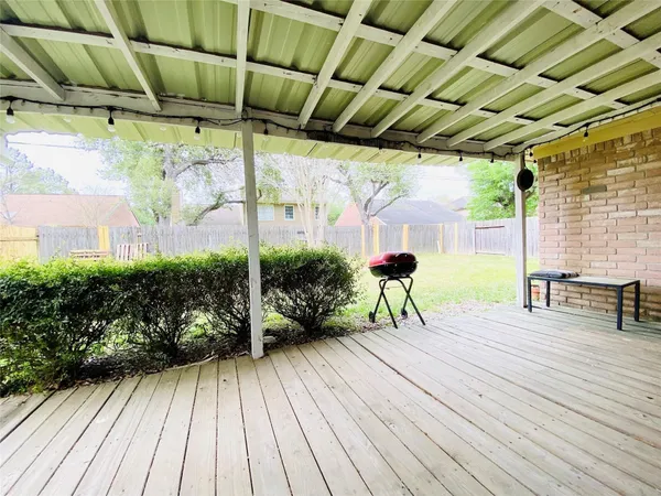 a sitting area with furniture and wooden floor