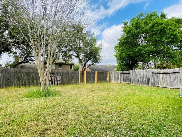 a front view of house with yard and trees