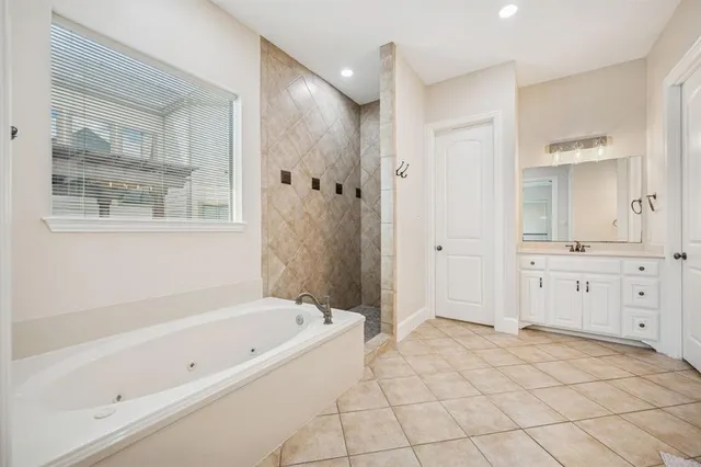a bathroom with a sink vanity and mirror
