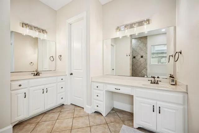 a white bath tub sitting next to a shower