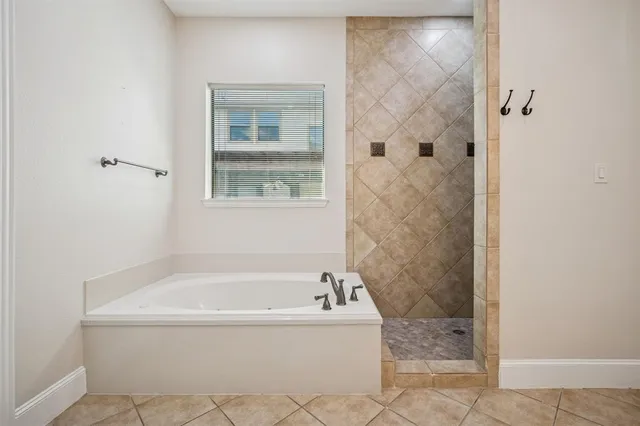 an empty room with windows and outdoor view