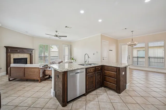 a kitchen with stainless steel appliances granite countertop a sink and cabinets