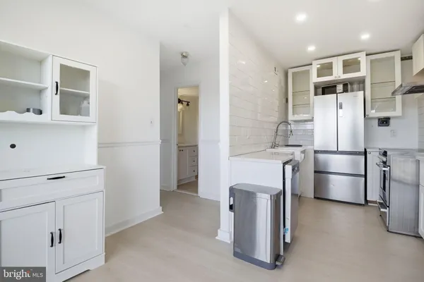 a bathroom with a bathtub and shower