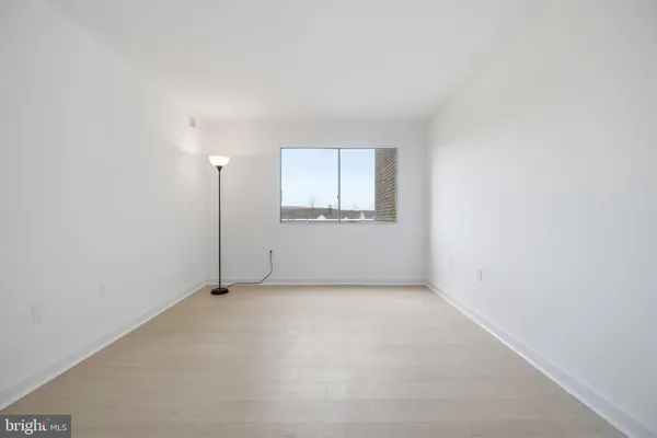 a view of a brick house with a large window