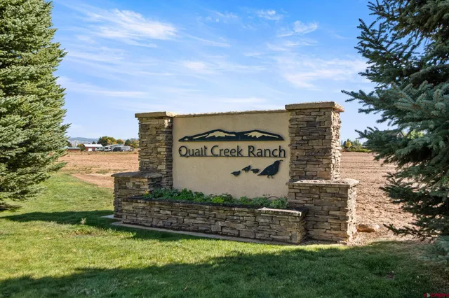 an aerial view of a residential houses with outdoor space