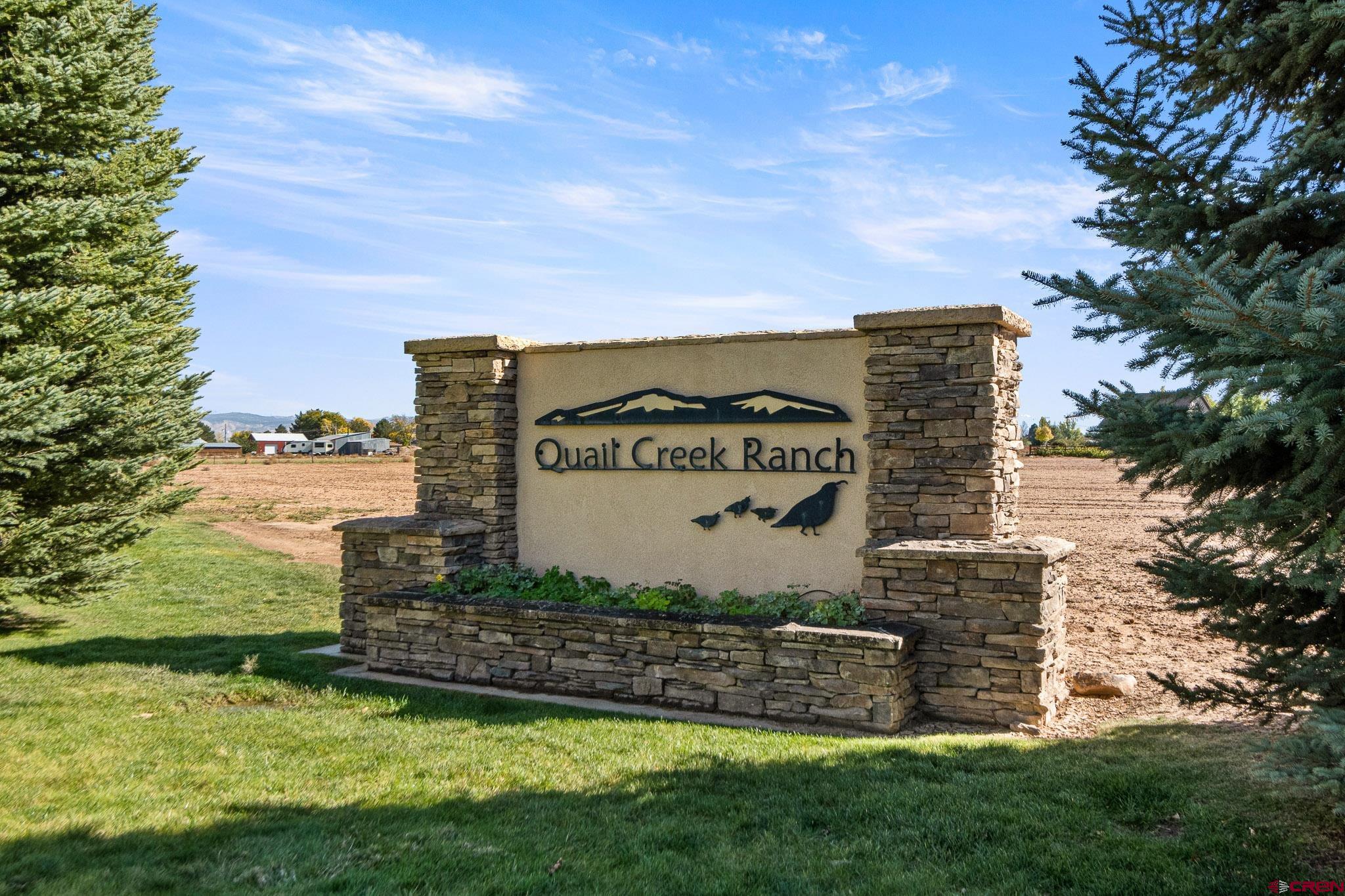 Lot 2 6260th Road Montrose, CO 81403 - Photo 9 of 10 a view of a street with a building in the background