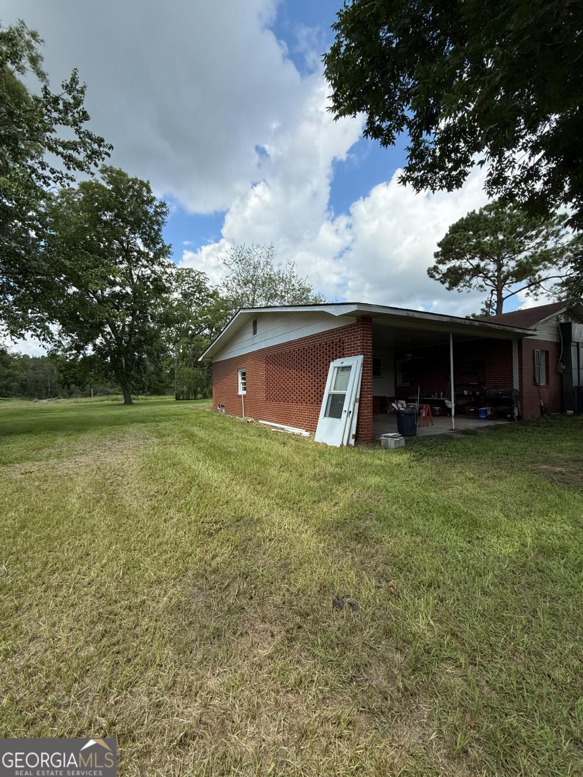 221 Rentz Bridge Road Lenox, GA 31637 - Photo 14 of 19 a view of a house with a yard