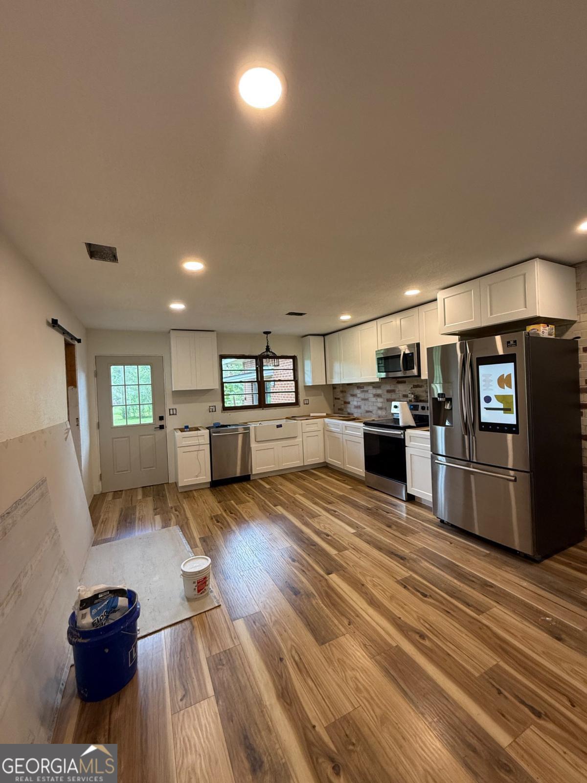 221 Rentz Bridge Road Lenox, GA 31637 - Photo 2 of 19 a living room with furniture and a wooden floor