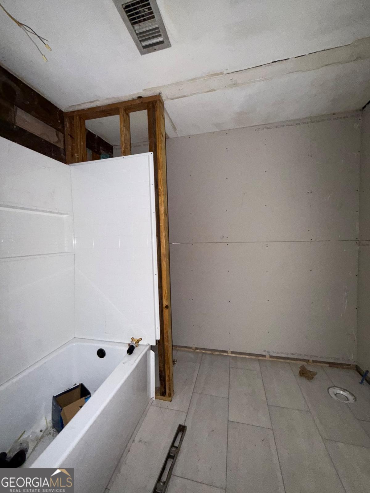 221 Rentz Bridge Road Lenox, GA 31637 - Photo 7 of 19 a bathroom with a bathtub and a shower