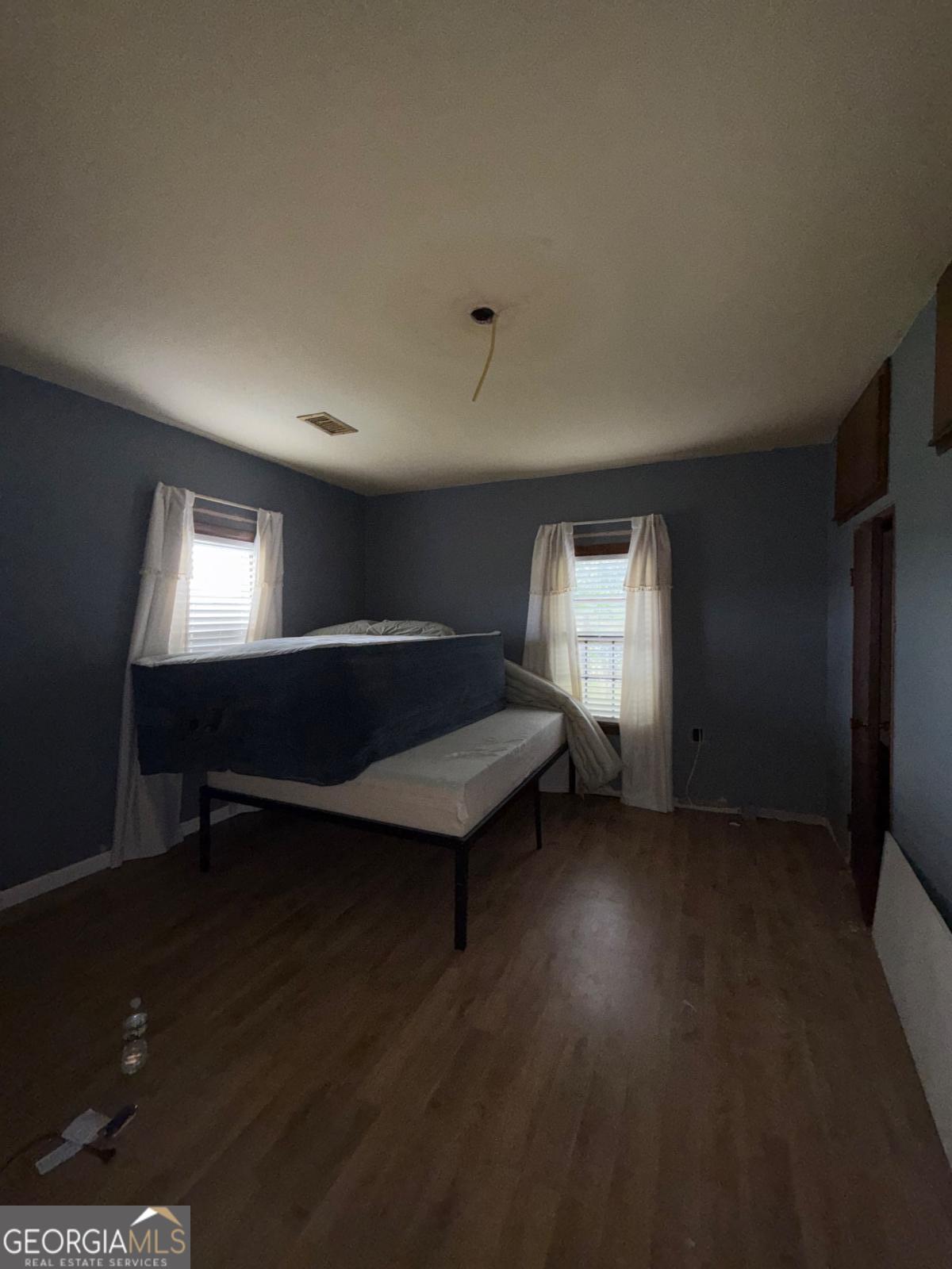 221 Rentz Bridge Road Lenox, GA 31637 - Photo 10 of 19 a living room with hard wood floors and a window