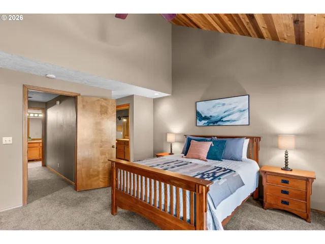 a bedroom with a bed and lamp