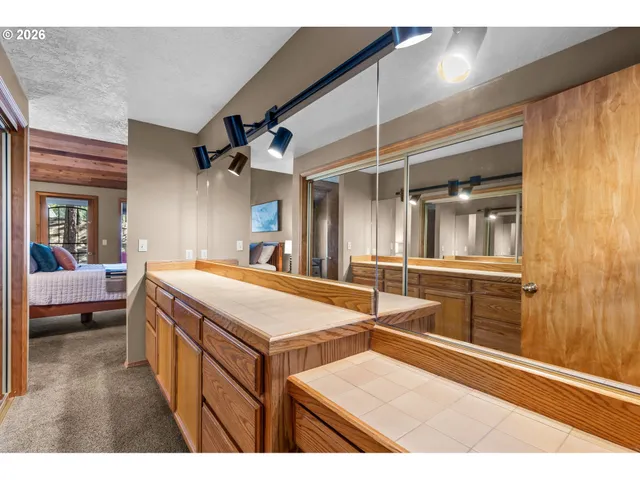 a room with a large bed and furniture