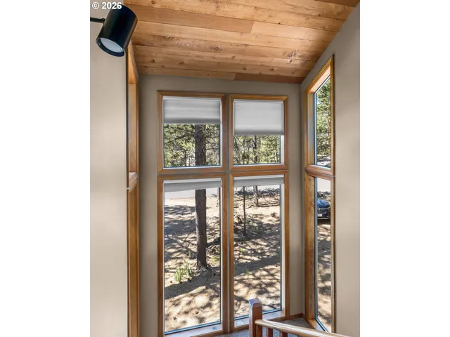 a view of a hallway with windows