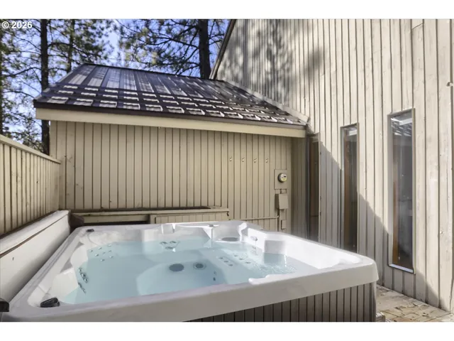 a view of a backyard with sitting area