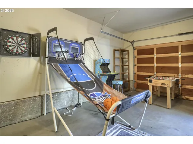 a room with furniture a flat screen tv and a table