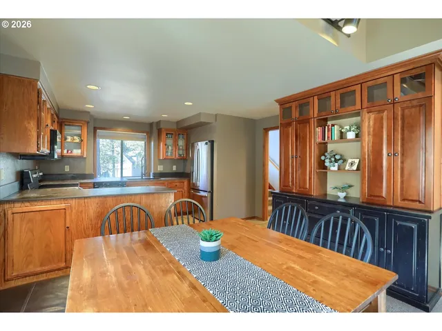 a view of a kitchen with a large window