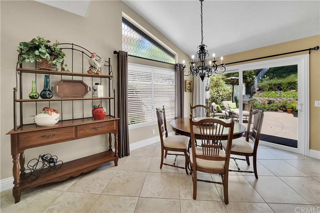 19 Springbrook Road Laguna Niguel, CA 92677 - Photo 11 of 41 a view of a dining room with furniture window and outside view