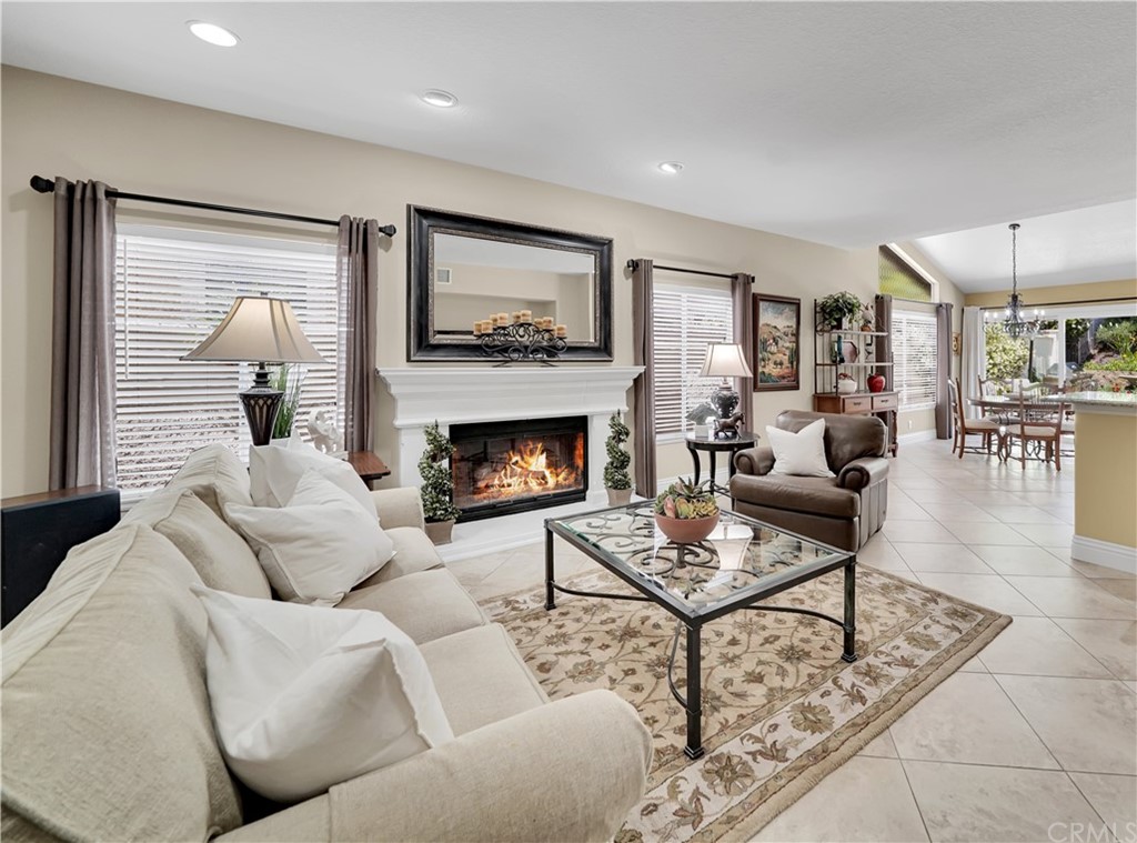 19 Springbrook Road Laguna Niguel, CA 92677 - Photo 14 of 41 a living room with furniture a fireplace and a flat screen tv