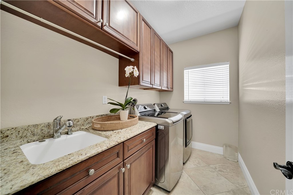 19 Springbrook Road Laguna Niguel, CA 92677 - Photo 19 of 41 a bathroom with a sink and a mirror