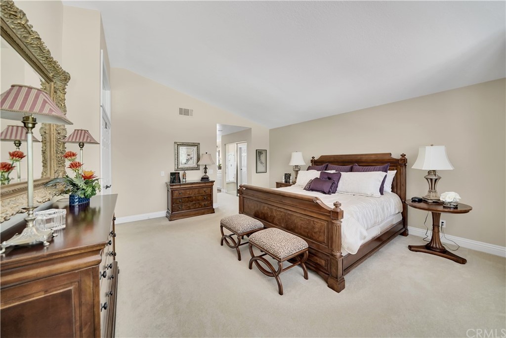 19 Springbrook Road Laguna Niguel, CA 92677 - Photo 21 of 41 a bedroom with a bed and potted plants on the dresser