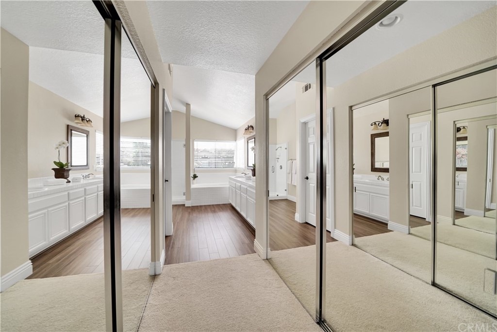 19 Springbrook Road Laguna Niguel, CA 92677 - Photo 22 of 41 a view of a hallway with wooden floor and a bathroom