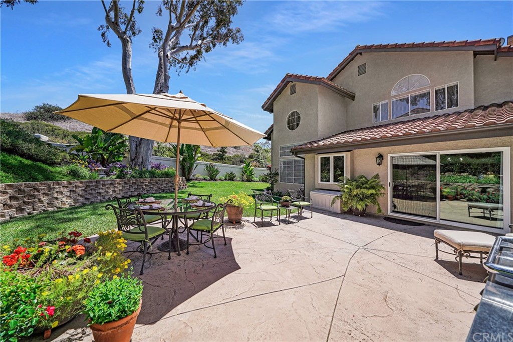 19 Springbrook Road Laguna Niguel, CA 92677 - Photo 33 of 41 a view of a house with backyard sitting area and garden