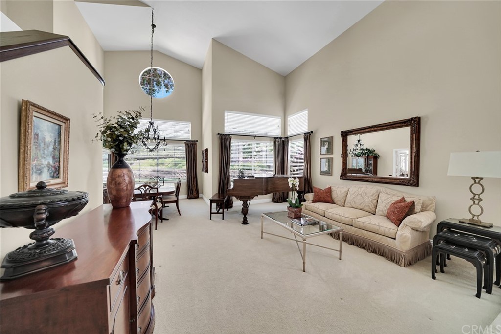 19 Springbrook Road Laguna Niguel, CA 92677 - Photo 5 of 41 a living room with furniture a chandelier and a window