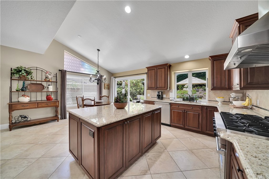19 Springbrook Road Laguna Niguel, CA 92677 - Photo 8 of 41 a kitchen with a stove sink and cabinets