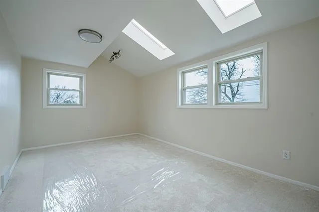 a view of a hallway with windows