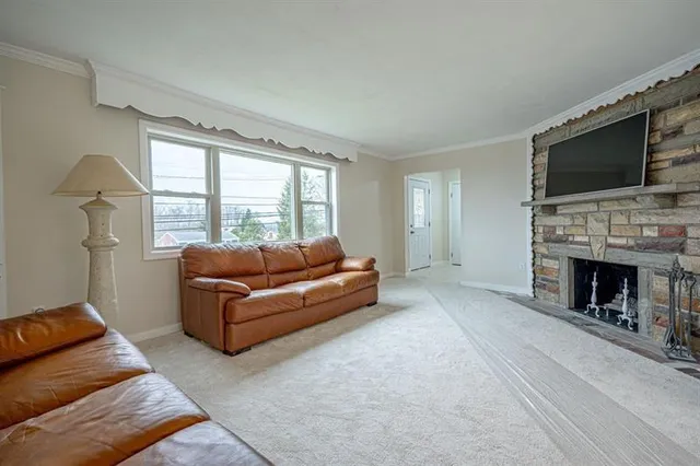 a bedroom with furniture and a fireplace
