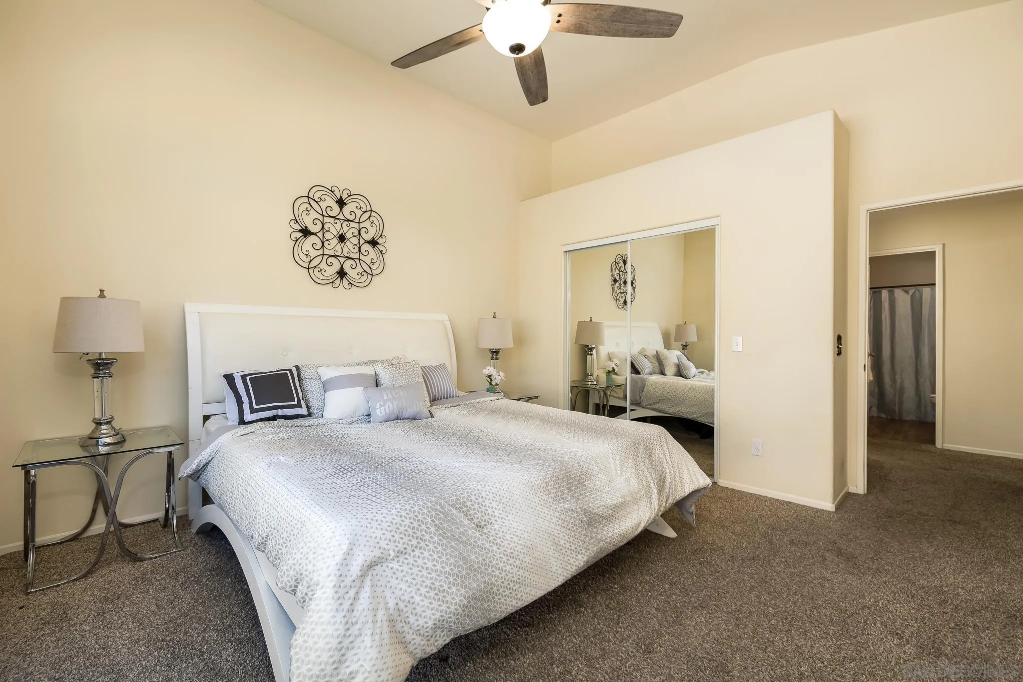 2344 Hyacinth Road Alpine, CA 91901 - Photo 11 of 29 a bedroom with a bed and a chandelier