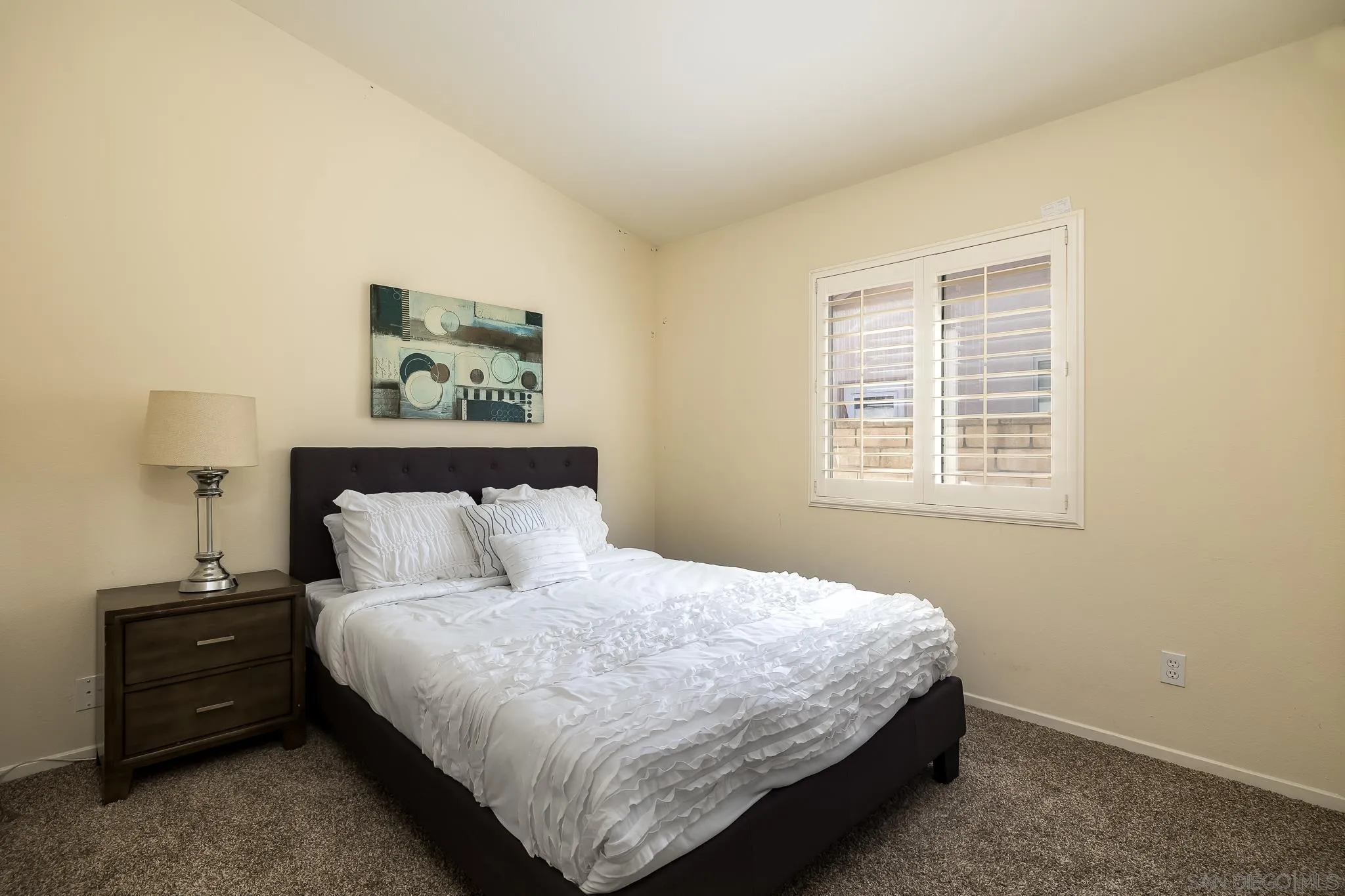 2344 Hyacinth Road Alpine, CA 91901 - Photo 14 of 29 a bed sitting in a bedroom next to a window