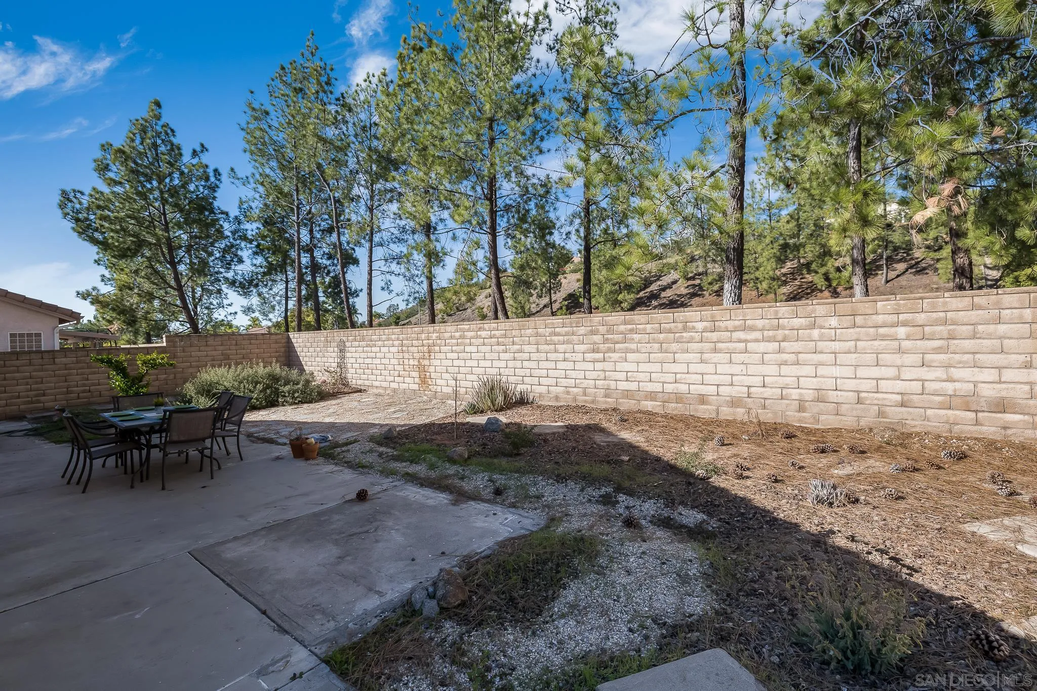 2344 Hyacinth Road Alpine, CA 91901 - Photo 20 of 29 a view of a backyard with table and chairs