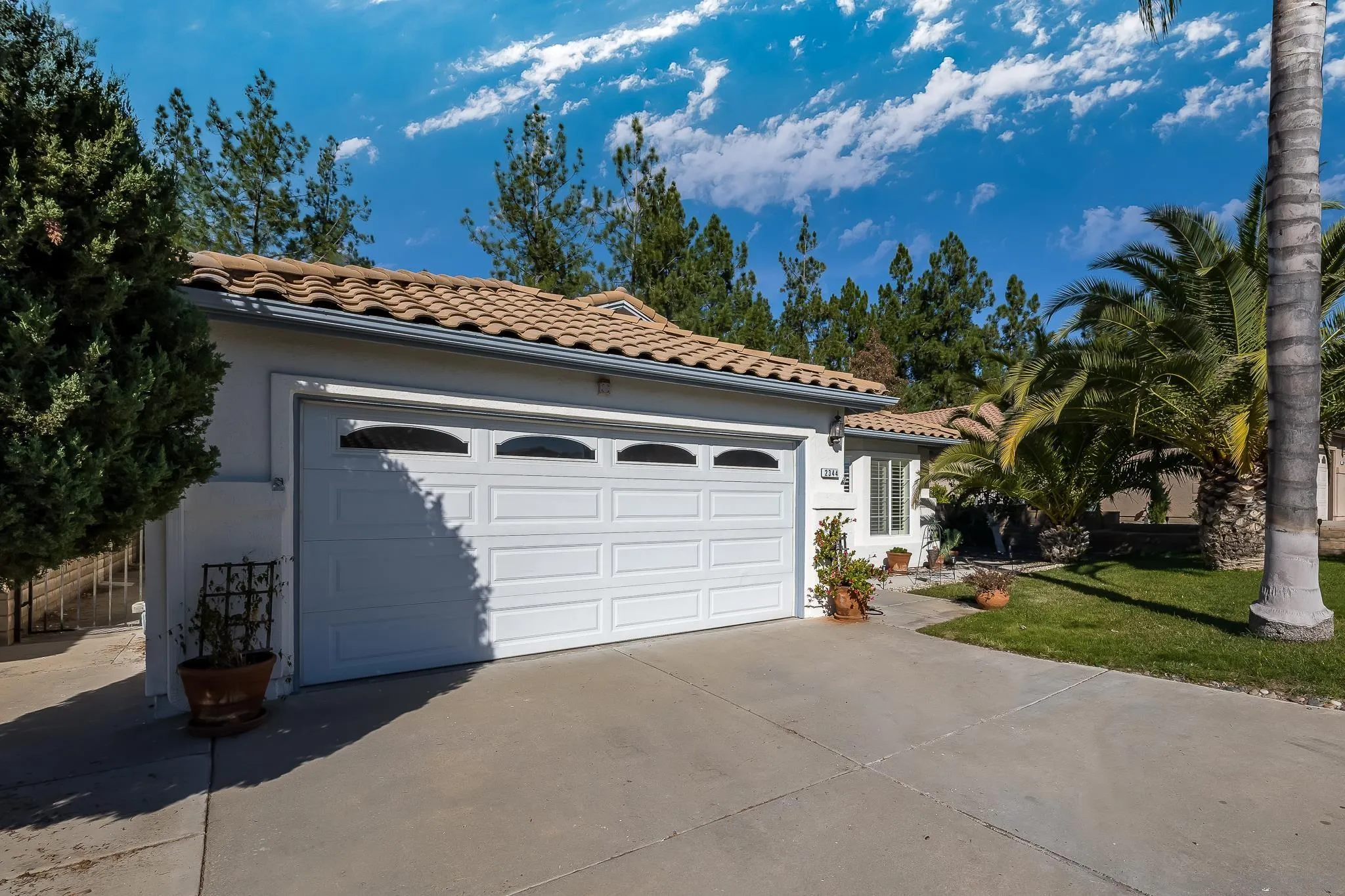 2344 Hyacinth Road Alpine, CA 91901 - Photo 2 of 29 a view of a house with a yard and garage