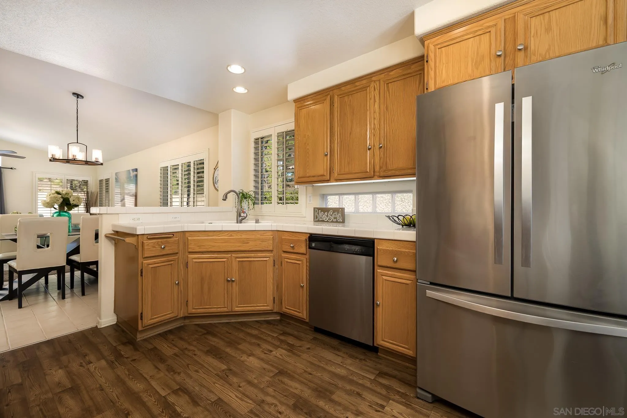 2344 Hyacinth Road Alpine, CA 91901 - Photo 9 of 29 a kitchen with stainless steel appliances granite countertop a refrigerator a stove a sink and a microwave